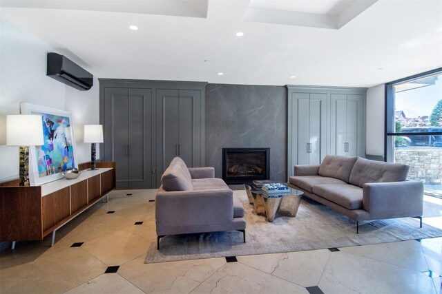 18 Rivers Edge Dr Unit 506, Tarrytown, NY 10591 - living area with a high end fireplace, recessed lighting, a wall unit AC, and a wall of windows