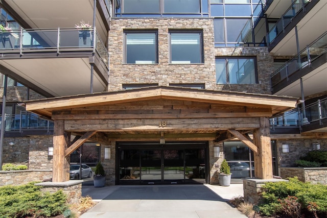 18 Rivers Edge Dr Unit 506, Tarrytown, NY 10591 - view of building exterior featuring a garage and driveway