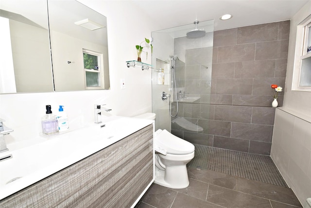 full bath featuring toilet, vanity, walk in shower, recessed lighting, and tile patterned floors
