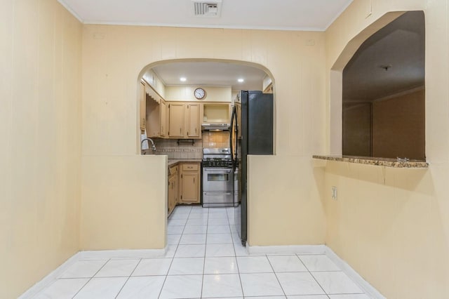 kitchen featuring stainless steel gas stove, arched walkways, visible vents, under cabinet range hood, and decorative backsplash