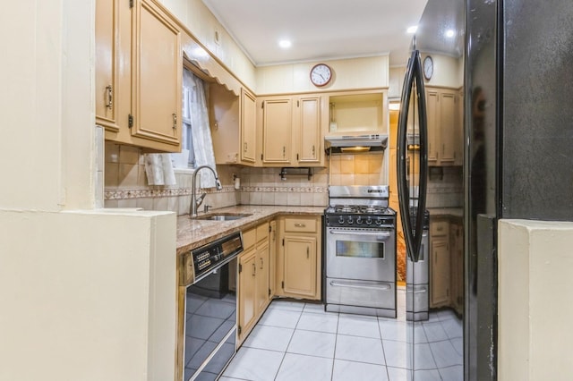 kitchen featuring light tile patterned floors, a sink, under cabinet range hood, black appliances, and decorative backsplash