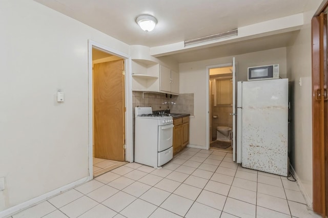 kitchen featuring tasteful backsplash, baseboards, white appliances, light tile patterned floors, and open shelves