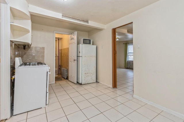 kitchen featuring light tile patterned floors, open shelves, white appliances, radiator heating unit, and decorative backsplash