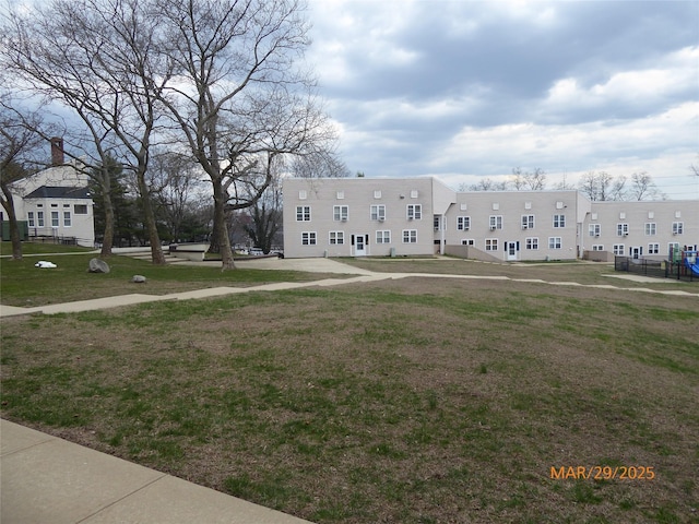 view of property's community featuring a yard