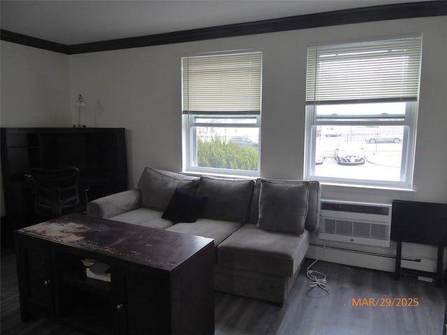 living room with a wall mounted AC, a baseboard radiator, crown molding, and wood finished floors