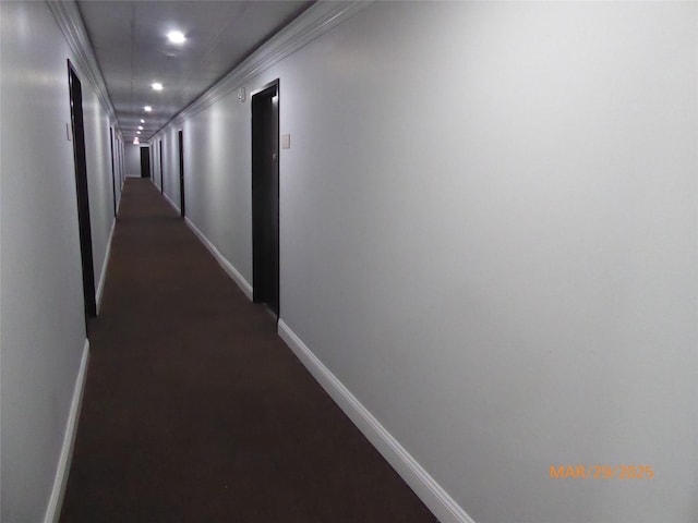 corridor with baseboards and recessed lighting