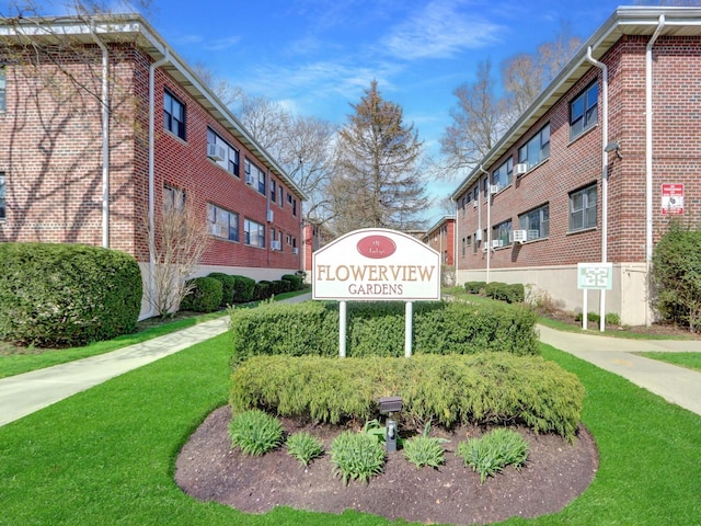 91 Tulip Ave Unit E1, Floral Park, NY 11001 - community / neighborhood sign featuring a lawn