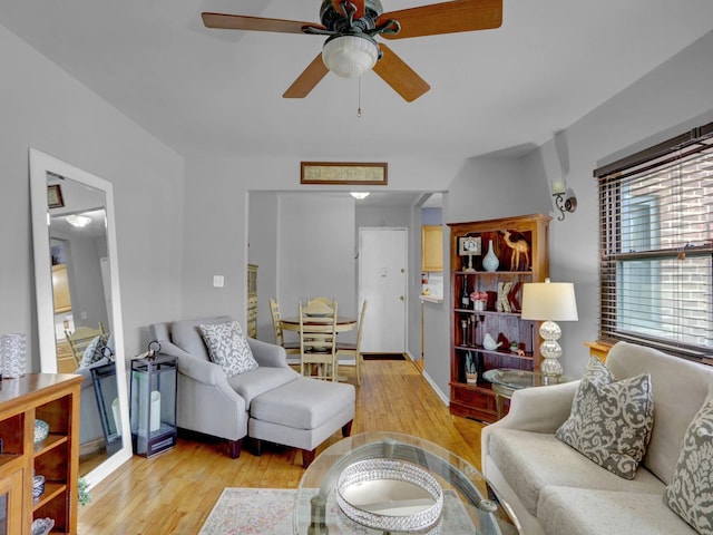 91 Tulip Ave Unit E1, Floral Park, NY 11001 - living area featuring light wood-style floors, ceiling fan, and baseboards