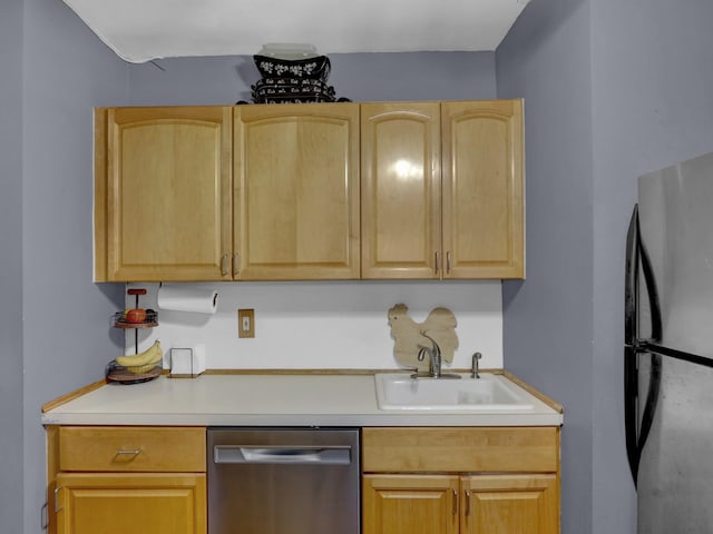 91 Tulip Ave Unit E1, Floral Park, NY 11001 - kitchen featuring stainless steel appliances, light brown cabinetry, a sink, and light countertops