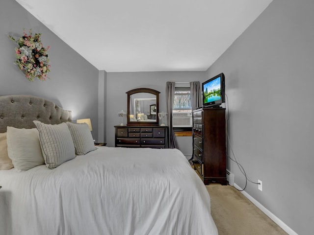 91 Tulip Ave Unit E1, Floral Park, NY 11001 - bedroom featuring carpet floors, baseboards, and baseboard heating