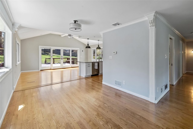 unfurnished living room featuring a ceiling fan, visible vents, and light wood-style flooring