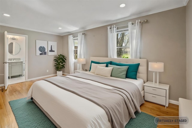 bedroom with recessed lighting, wood finished floors, baseboards, and multiple windows