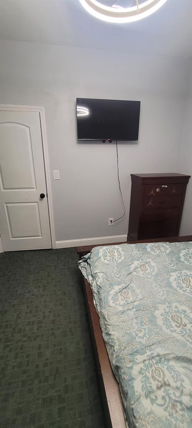 bedroom featuring baseboards
