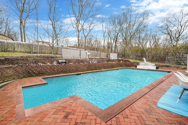 view of swimming pool with a fenced in pool, a patio, and a fenced backyard