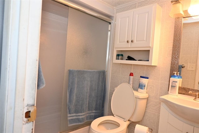 full bath featuring toilet, tile walls, a stall shower, decorative backsplash, and crown molding