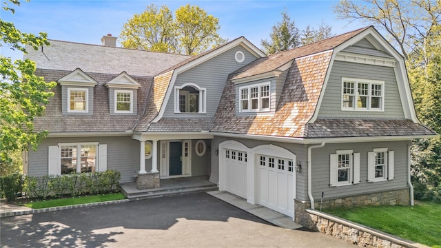 32 Pryer Ln, Larchmont, NY 10538 - shingle-style home with a garage, a gambrel roof, aphalt driveway, and a chimney