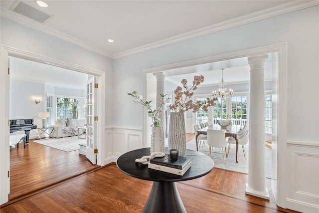 32 Pryer Ln, Larchmont, NY 10538 - dining space with crown molding, visible vents, wainscoting, and wood finished floors
