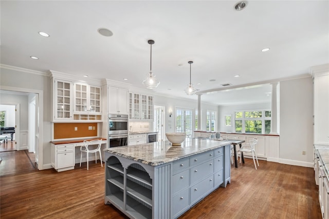 32 Pryer Ln, Larchmont, NY 10538 - kitchen with crown molding, stainless steel double oven, open shelves, and white cabinets