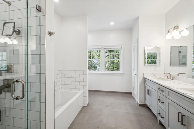 32 Pryer Ln, Larchmont, NY 10538 - bathroom featuring a sink, double vanity, recessed lighting, a shower stall, and a garden tub