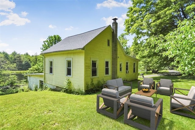 66-68 Spook Hole Rd, Ellenville, NY 12428 - back of house with an outdoor living space, a shingled roof, a chimney, and a lawn