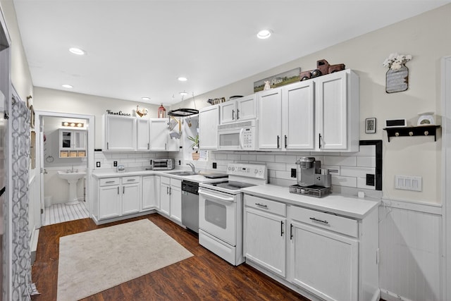 155 Tuckers Corners Rd, Plattekill, NY 12528 - kitchen featuring white appliances, white cabinetry, dark wood-type flooring, backsplash, and recessed lighting