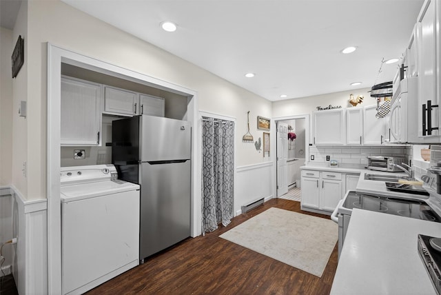 155 Tuckers Corners Rd, Plattekill, NY 12528 - kitchen with washer / dryer, white appliances, a wainscoted wall, a baseboard heating unit, and dark wood-style floors