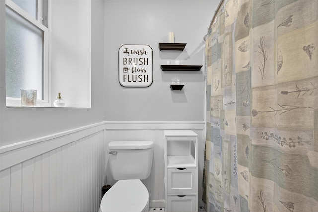155 Tuckers Corners Rd, Plattekill, NY 12528 - full bath featuring wainscoting, a decorative wall, and a shower with shower curtain