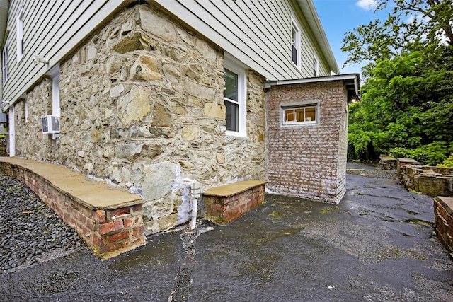 155 Tuckers Corners Rd, Plattekill, NY 12528 - view of property exterior featuring stone siding and a patio area