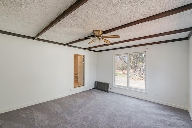spare room with baseboards, a textured ceiling, beam ceiling, ceiling fan, and carpet