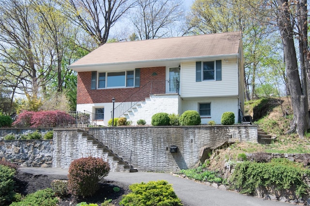 bi-level home featuring stairway