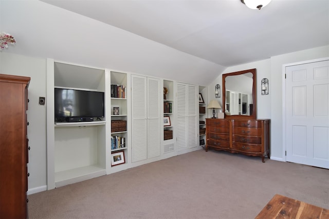 carpeted bedroom featuring vaulted ceiling