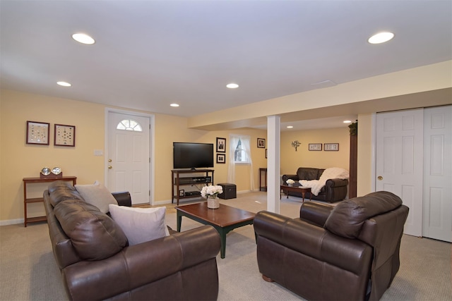 living area featuring recessed lighting, light carpet, and baseboards
