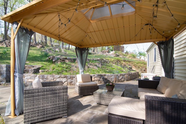 view of patio with a gazebo and an outdoor living space