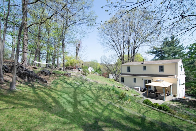 view of yard with a gazebo, a patio area, and an outdoor living space