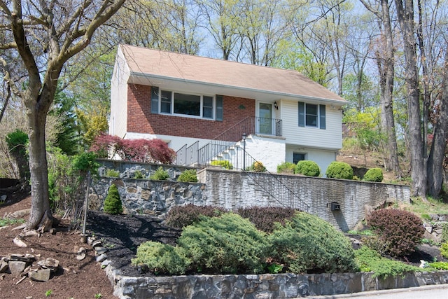 view of front of home featuring stairs