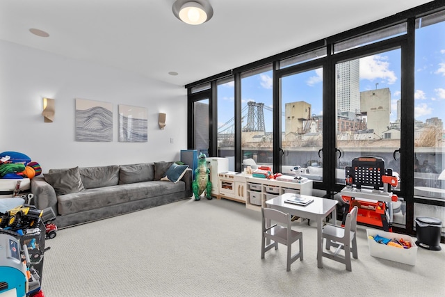 interior space with a view of city, expansive windows, and carpet floors