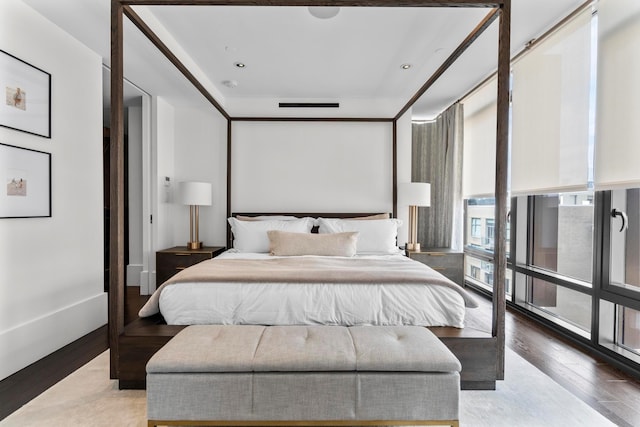 bedroom featuring visible vents and light wood-style floors