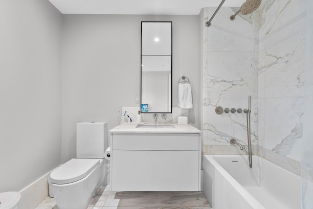 bathroom featuring toilet, marble finish floor, vanity, and bathing tub / shower combination