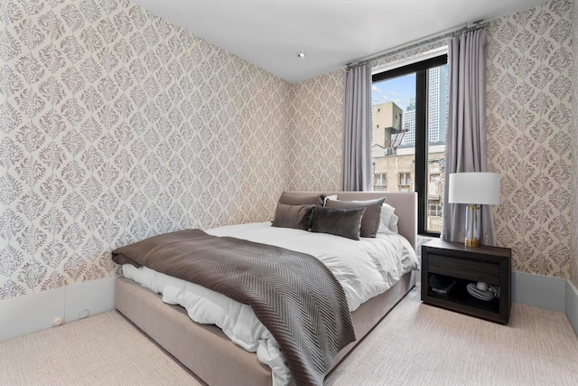 bedroom with wallpapered walls
