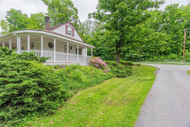 6 Swain Dr, Pleasant Valley, NY 12569 - farmhouse featuring a chimney, covered porch, and asphalt driveway