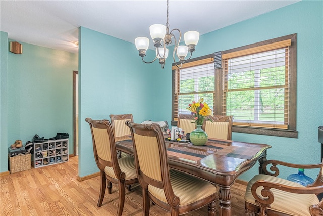 6 Swain Dr, Pleasant Valley, NY 12569 - dining space featuring a chandelier, light wood-type flooring, baseboards, and a textured wall