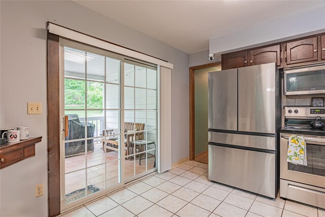 6 Swain Dr, Pleasant Valley, NY 12569 - kitchen featuring stainless steel appliances, light tile patterned floors, and baseboards