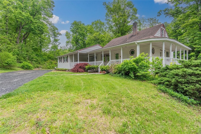 6 Swain Dr, Pleasant Valley, NY 12569 - country-style home featuring covered porch, a front lawn, a chimney, and asphalt driveway