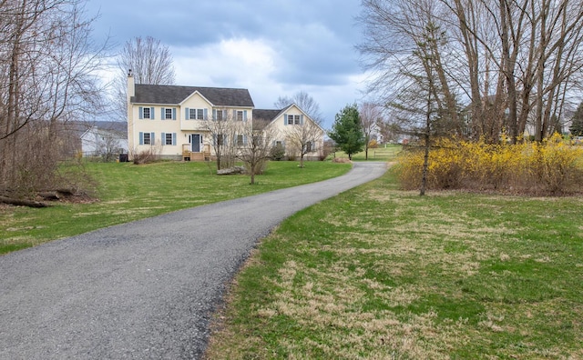 exterior space with aphalt driveway