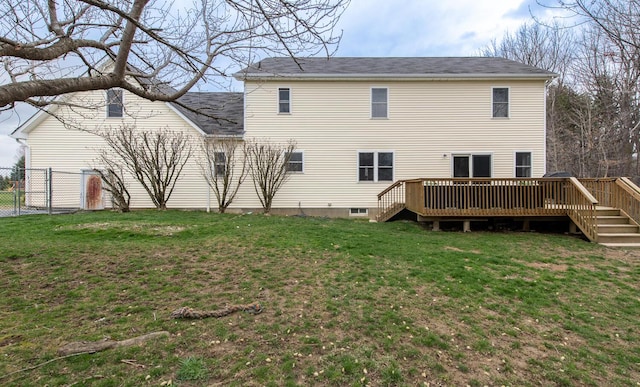 rear view of house with a yard, stairway, fence, and a wooden deck