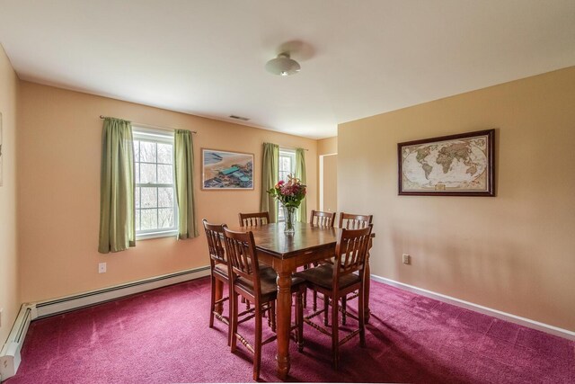 dining space featuring baseboards, carpet, a baseboard heating unit, and visible vents