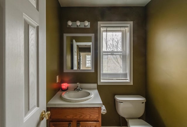 bathroom with toilet and vanity