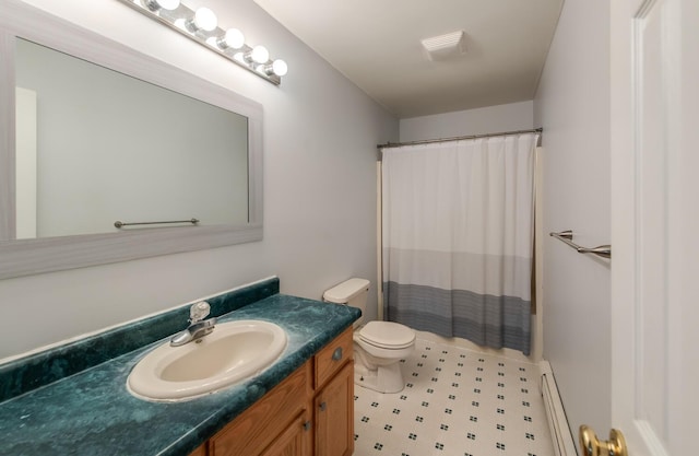 full bathroom with vanity, a shower with shower curtain, baseboard heating, and toilet