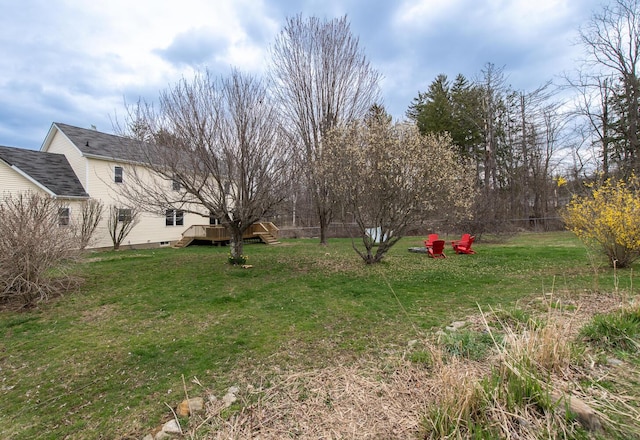 view of yard featuring a wooden deck