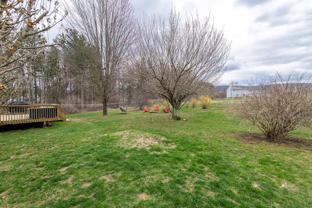 view of yard featuring a wooden deck
